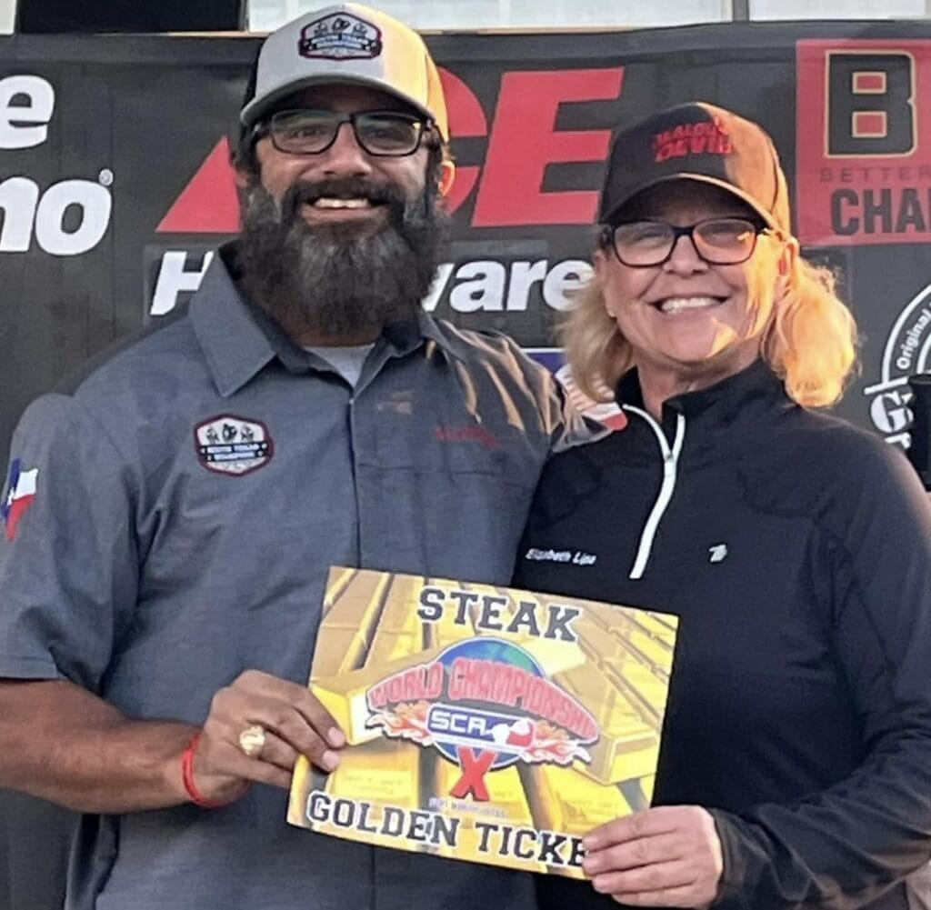 Elizabeth Lipa handing the Golden Ticket to Alfred Hanna