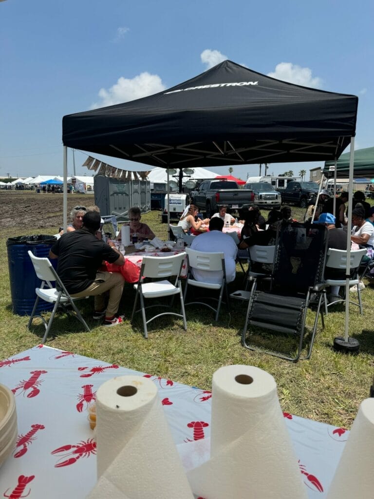 People enjoying the crawfish by the Data Projections Team