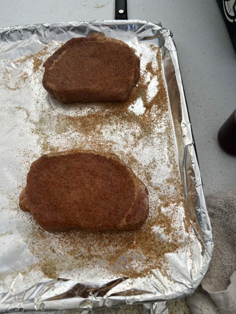 Austyn seasoning the pork chops