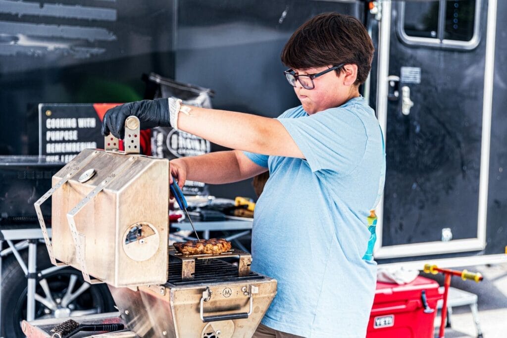 Austyn Grilling his Pork Chop