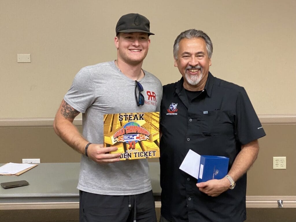 James Garza winning 1st place in Steak B and won the belt buckle